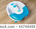 Feet in a vibrating foot massager.massage bath.  44748488
