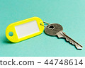 Yellow key tag on a turquoise  44748614