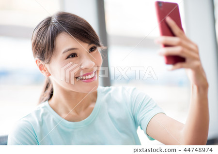 woman use phone selfie happily woman use phone selfie happily 44748974