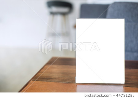 Mock up blank menu frame on table in coffee shop stand for your Mock up blank menu frame on table in coffee shop stand for your 44751283