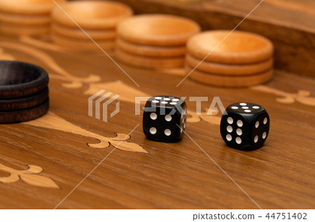 Dice on a backgammon board 44751402