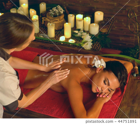 Deep tissue massage treatment in Ayurveda of woman in spa salon. Deep tissue massage treatment in Ayurveda of woman in spa salon. 44751891