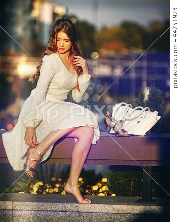Fashion woman in autumn spring dress bokeh effect . Fashion woman in autumn spring dress bokeh effect . 44751923