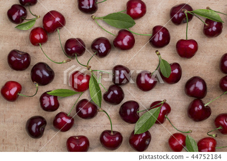 Ripe cherry on a wooden table 44752184