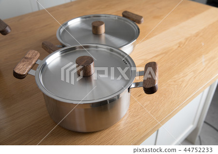 Stainless steel pot in the kitchen Stainless steel pot in the kitchen 44752233
