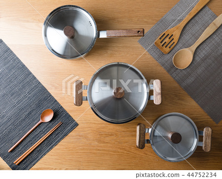 Stainless steel pot in the kitchen Stainless steel pot in the kitchen 44752234
