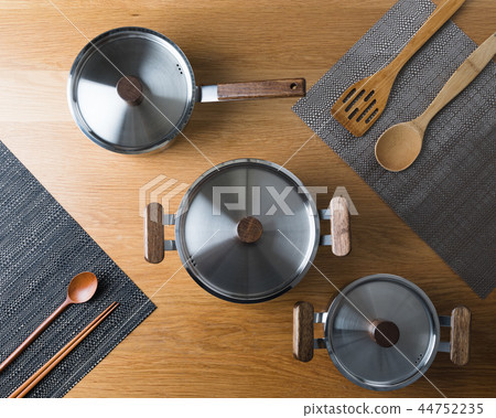 Stainless steel pot in the kitchen Stainless steel pot in the kitchen 44752235