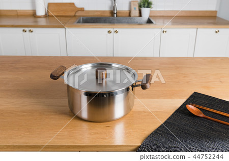 Stainless steel pot in the kitchen Stainless steel pot in the kitchen 44752244