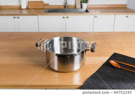 Stainless steel pot in the kitchen Stainless steel pot in the kitchen 44752245