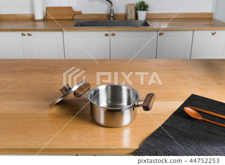 Stainless steel pot in the kitchen Stainless steel pot in the kitchen 44752253