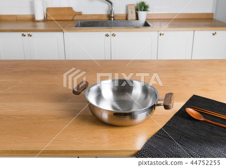 Stainless steel pot in the kitchen Stainless steel pot in the kitchen 44752255