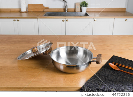 Stainless steel pot in the kitchen Stainless steel pot in the kitchen 44752256