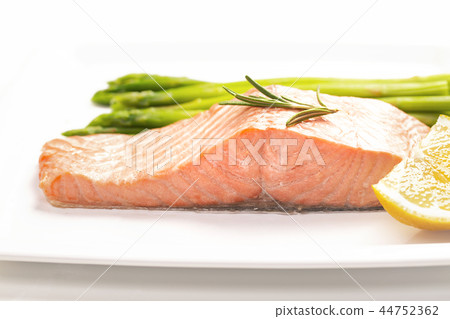 Steamed salmon and asparagus on a white plate Steamed salmon and asparagus on a white plate 44752362