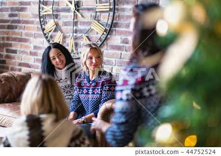 Group of young women hanging out on a New Year's party 44752524