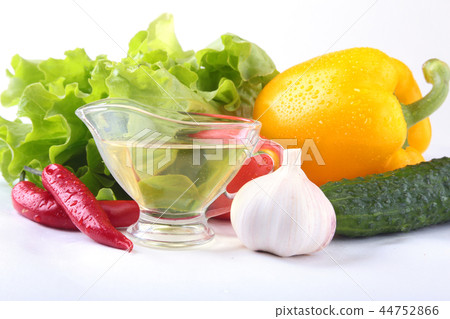 Assorted vegetables, fresh bell pepper, tomato, chilli pepper, cucumber, olive oil, garlic and Assorted vegetables, fresh bell pepper, tomato, chilli pepper, cucumber, olive oil, garlic and 44752866