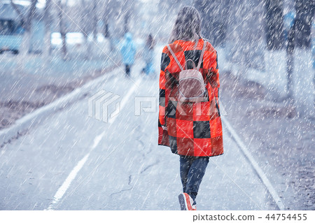 rainy weather girl posing fall / raindrops, spray, girl adult on a rain background rainy weather girl posing fall / raindrops, spray, girl adult on a rain background 44754455