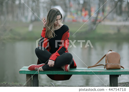 girl in coat outdoor / autumn photo model girl adult posing in park, girl in coat with long hair 44754718