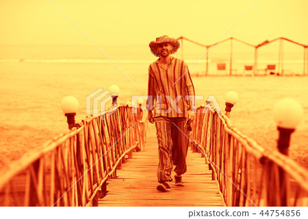 man on the beach in india, ocean, coast, vacation. rest on goa man on the beach in india, ocean, coast, vacation. rest on goa 44754856
