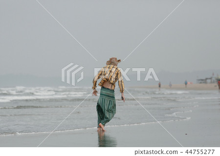 man on the beach in india, ocean, coast, vacation. rest on goa man on the beach in india, ocean, coast, vacation. rest on goa 44755277