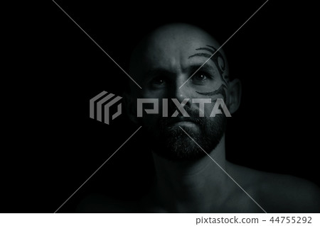 tattoo on the face, man with a tattoo, brutal bearded guy, studio portrait of a man tattoo on the face, man with a tattoo, brutal bearded guy, studio portrait of a man 44755292