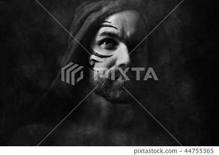 tattoo on the face, male portrait in the form of an assassin,\
cosplay, tattooed brutal man, guy with a tattooed face