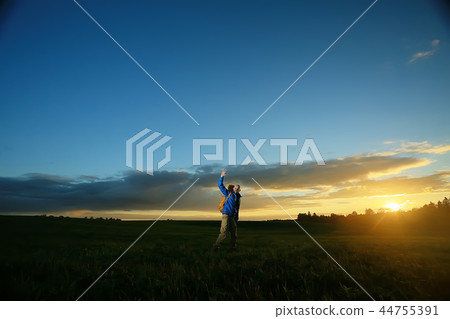 traveler man in the field, happy guy, concept freedom leisure nature, landscape beautiful place nature 44755391