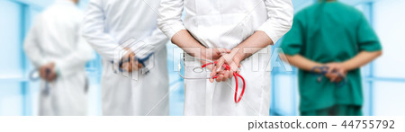 Doctor working in hospital with other doctors. Doctor working in hospital with other doctors. 44755792