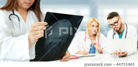 Doctor working in hospital with other doctors. Doctor working in hospital with other doctors. 44755965