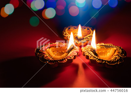 Happy Diwali - Clay Diya lamps lit during Dipavali 44756016