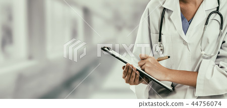 Woman doctor working at the hospital office. Woman doctor working at the hospital office. 44756074