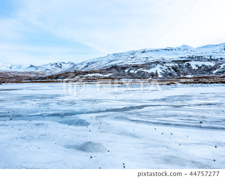 Kirkjufellfoss waterfall in winter, Iceland Kirkjufellfoss waterfall in winter, Iceland 44757277