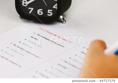 student's hand taking English test in class 44757579