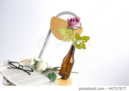 Chairs and roses and newspaper 44757877