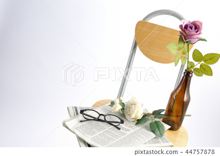 Chairs and roses and newspaper Chairs and roses and newspaper 44757878