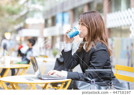Relax at the open cafe, suit young woman 44758197