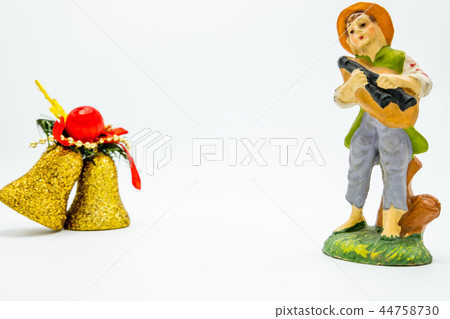 littered Christmas decoration bells and musician. littered Christmas decoration bells and musician. 44758730