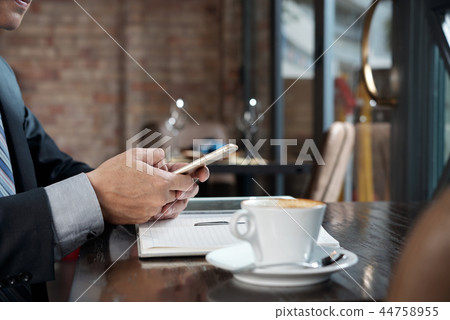 Texting entrepreneur Texting entrepreneur 44758955