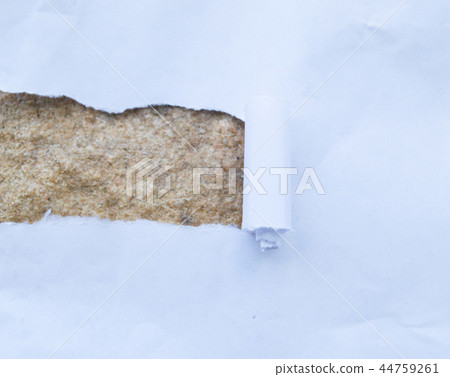 Torn paper with stone background 44759261