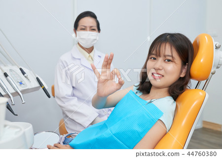 Teenage girl in dentist office 44760380