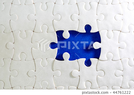 Close up piece of the white jigsaw puzzle 44761222