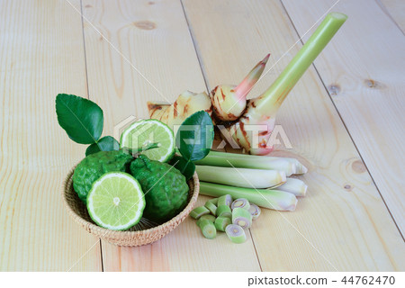 bergamot,lemon grass,galangal on wood background bergamot,lemon grass,galangal on wood background 44762470