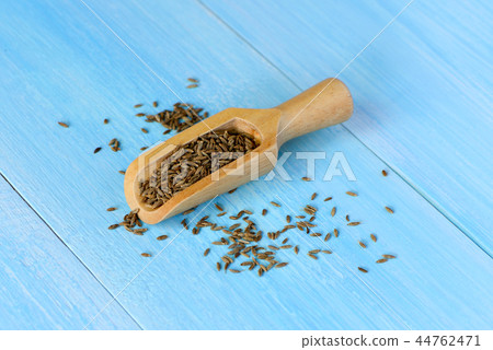 dried cumin seed or caraway in wooden scoop dried cumin seed or caraway in wooden scoop 44762471