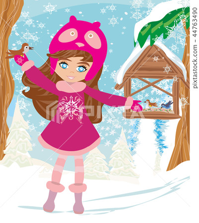 Girl feeds the birds in winter Girl feeds the birds in winter 44763490