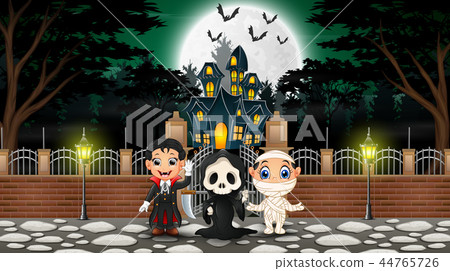 Happy kids wearing halloween costume outdoors with 44765726