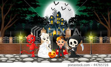 Happy kids wearing halloween costume outdoors with 44765728
