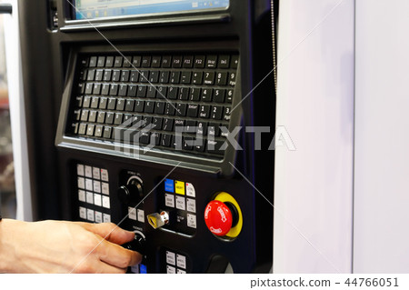 operator working with CNC lathe machine 44766051