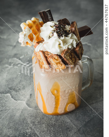 Chocolate milkshake with dripping sauce, cream 44767637