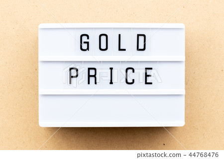 Light box with word gold price on wood background 44768476