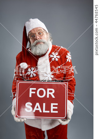 Tied up Santa Claus holding banner for sale Tied up Santa Claus holding banner for sale 44768545