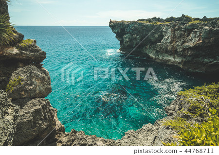 The cozy ocean bay surrounded by the cliffs. Sumba The cozy ocean bay surrounded by the cliffs. Sumba 44768711